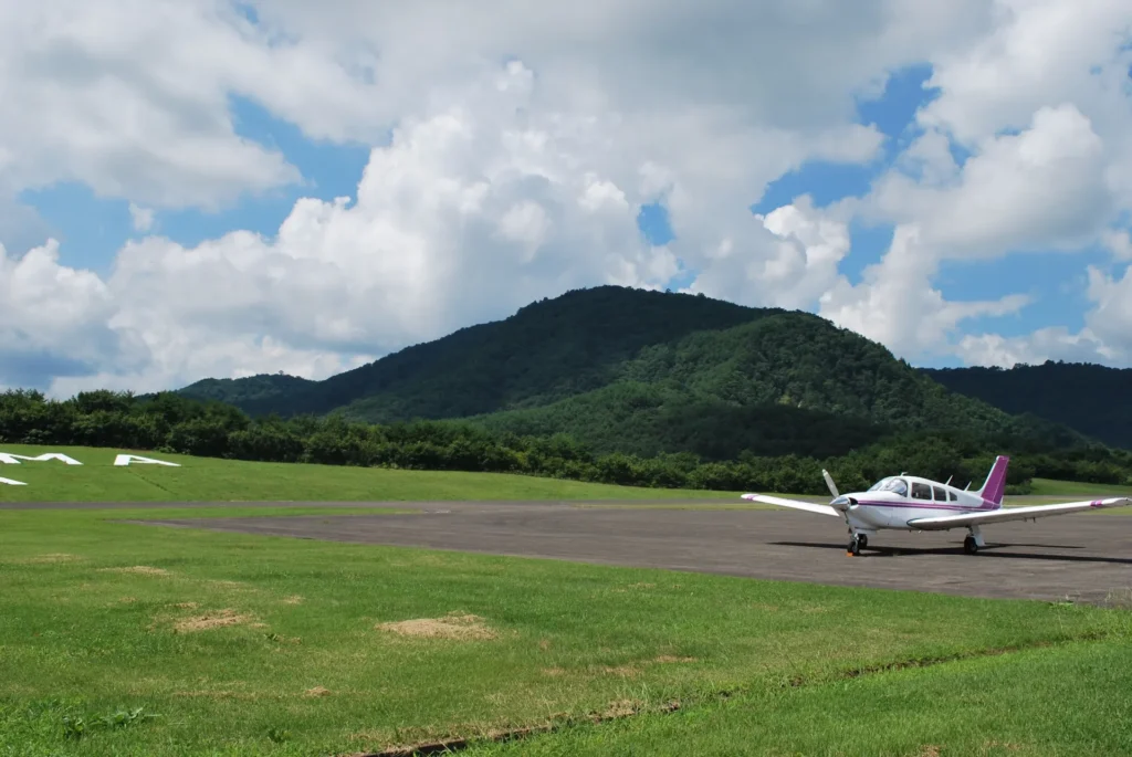 A Small Propeller Plane Parked on the Runway